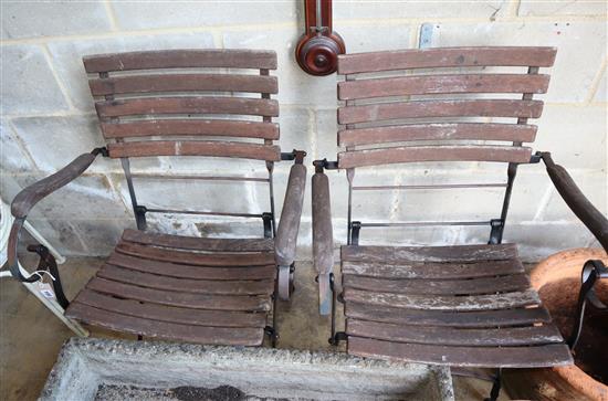 A pair of folding garden chairs